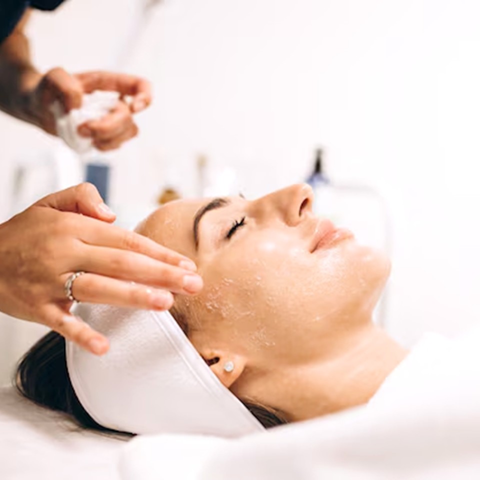 Close-up of a client receiving the Youth Skin Ritual nano-infusion facial, skin glowing and hydrated